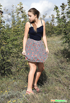 Girl strips as she tinkles on a quiet country road