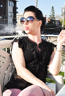 Redhead Mina in shades smoking frenzy drinking wine