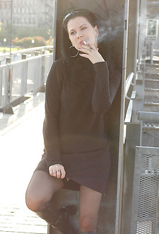 Sexy smoker in stockings flashes pussy in public