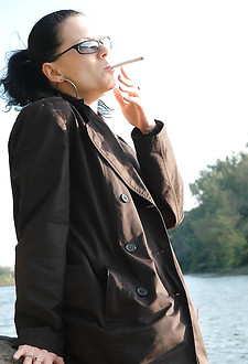 Ponytailed babe smokes 120 by a lake