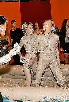 Hot naked wrestling hotties get completely covered in mud
