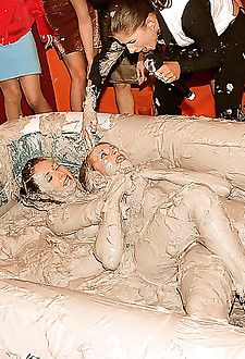 Two very hot lesbian babes duke it out in some thick mud