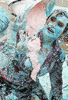 Nicely dressed hotty babes having a very messy pie fight