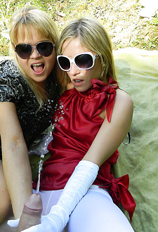 Sunglasses wearing chicks pissing and fucking a horny guy