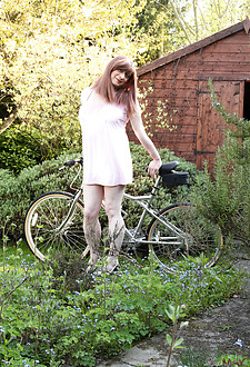 TGirl Luci takes her bike out for a spin, but ends up with her saddle up her ass and wanking in the garden