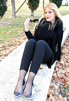 Christelle teases her toes bare while soaking up the sun