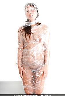 Bondage teen Tibbie in plastic sheet