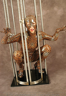 Spandex leo girl caught in a cage